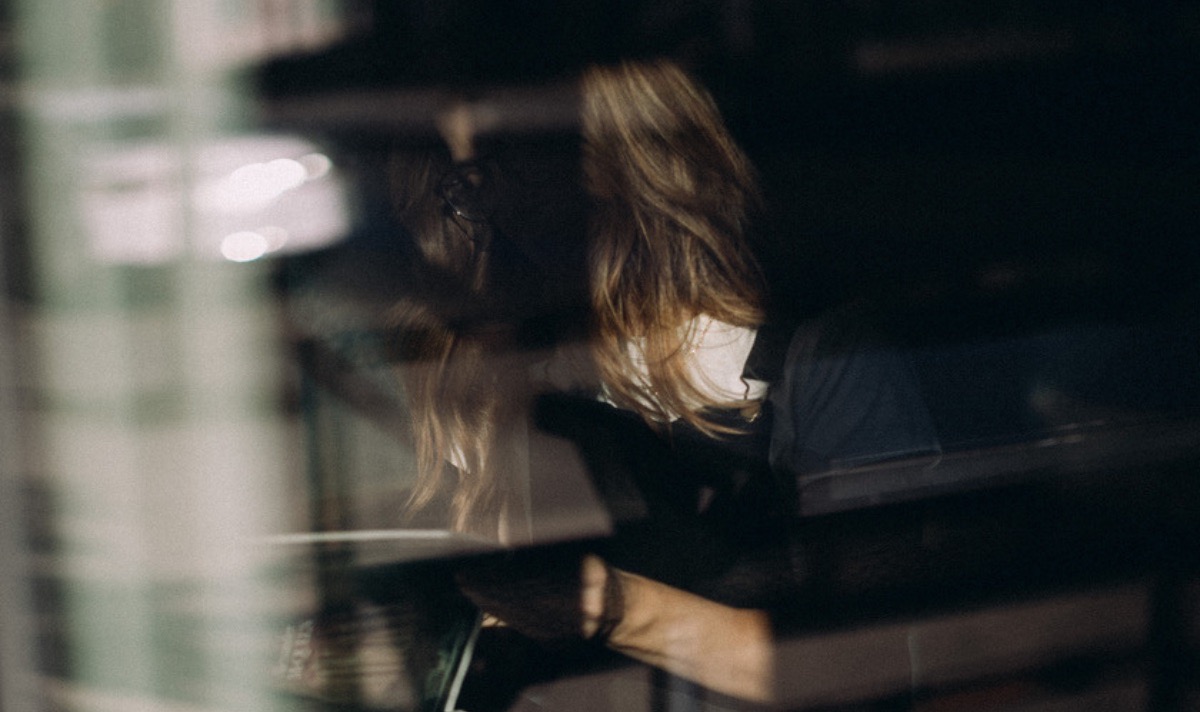 woman working at coffee shop on her business